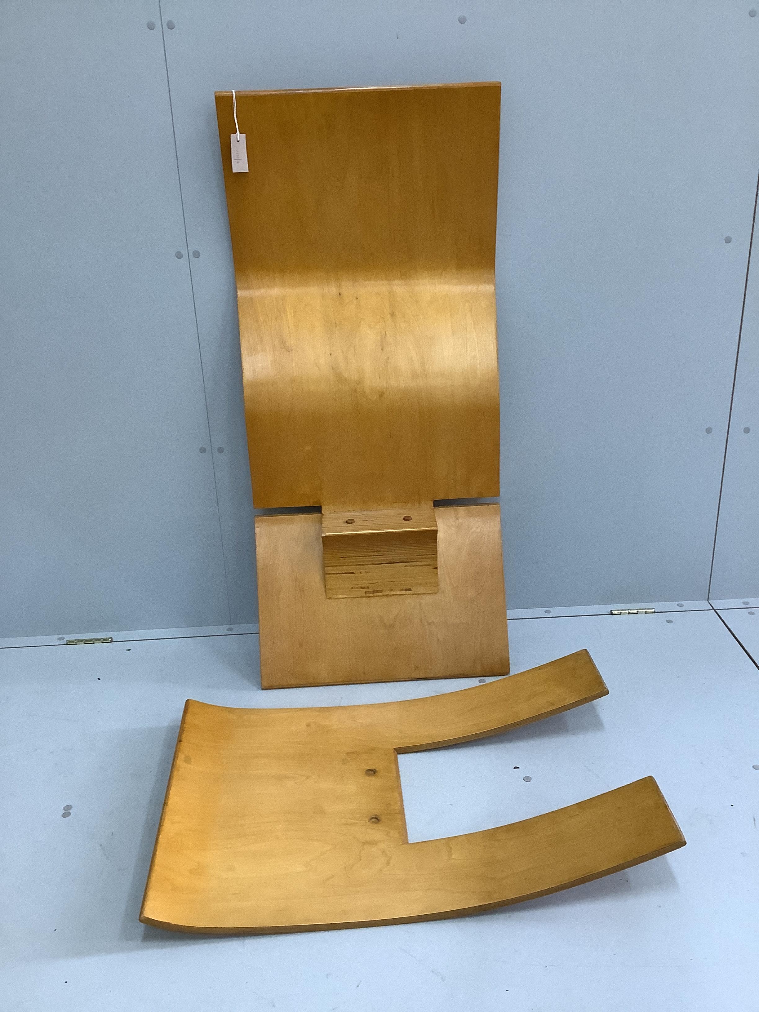 In the manner of Jens Nielson a mid century bent ply two section chair, width 56cm, depth 80cm, height 101cm